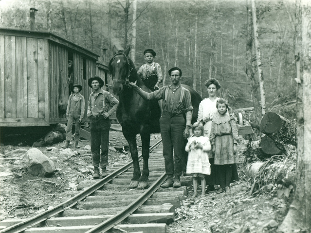 Young_family_in_lumber_camp_standard
